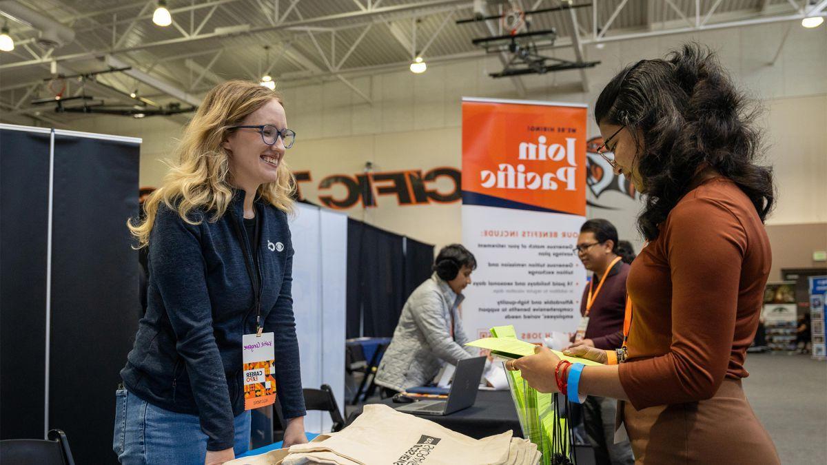 A student gets information at a booth during University of the Pacific's Career Expo.